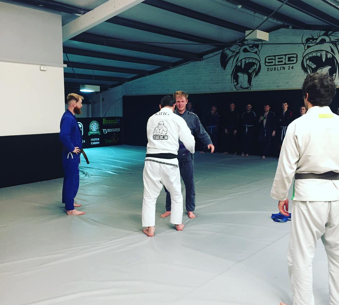 Andy receiving in purple belt in BJJ