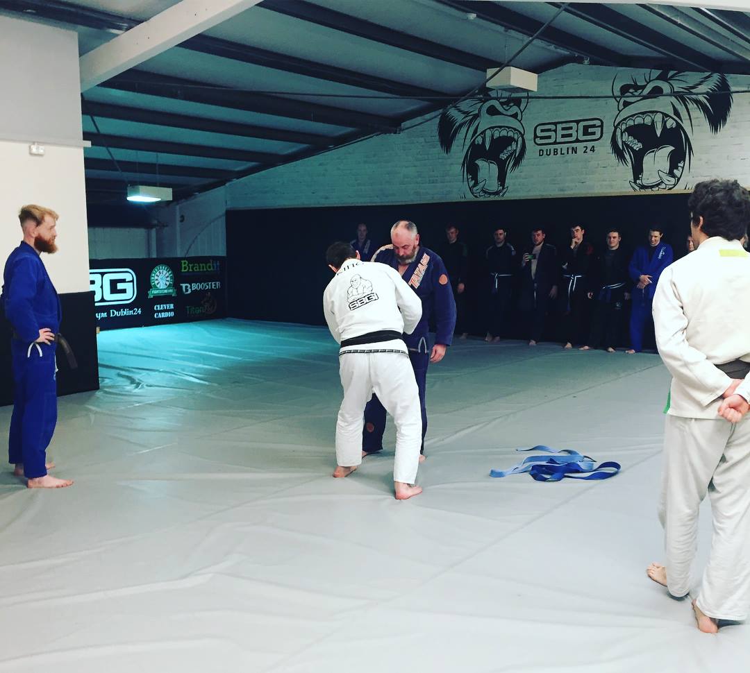 Jimmy receiving his purple belt in BJJ