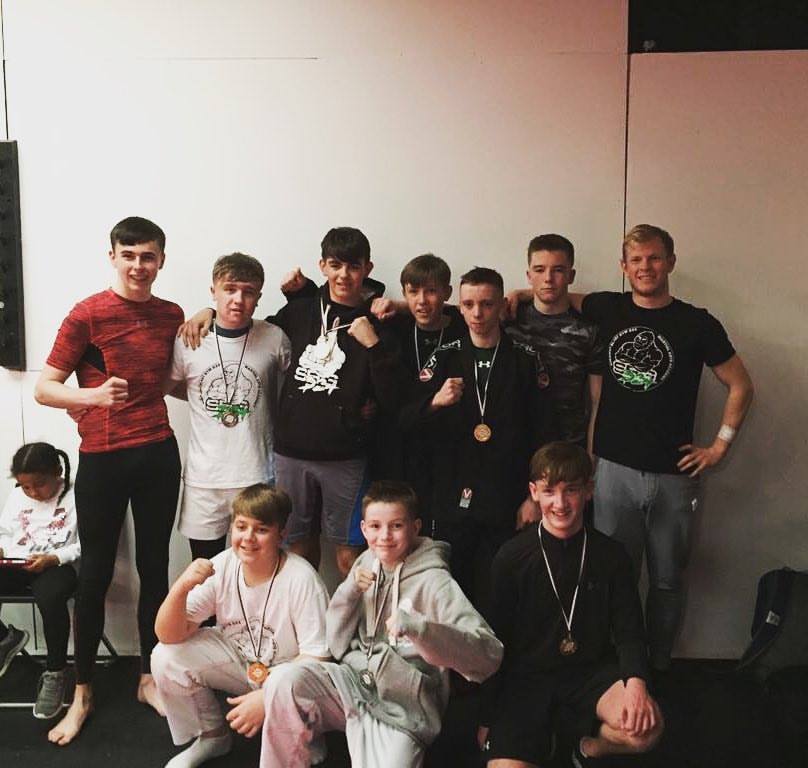 Coach Andy with the silverback team competing in teens BJJ